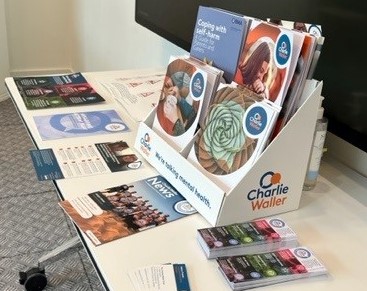 Selection of Charlie Waller resources displayed on table
