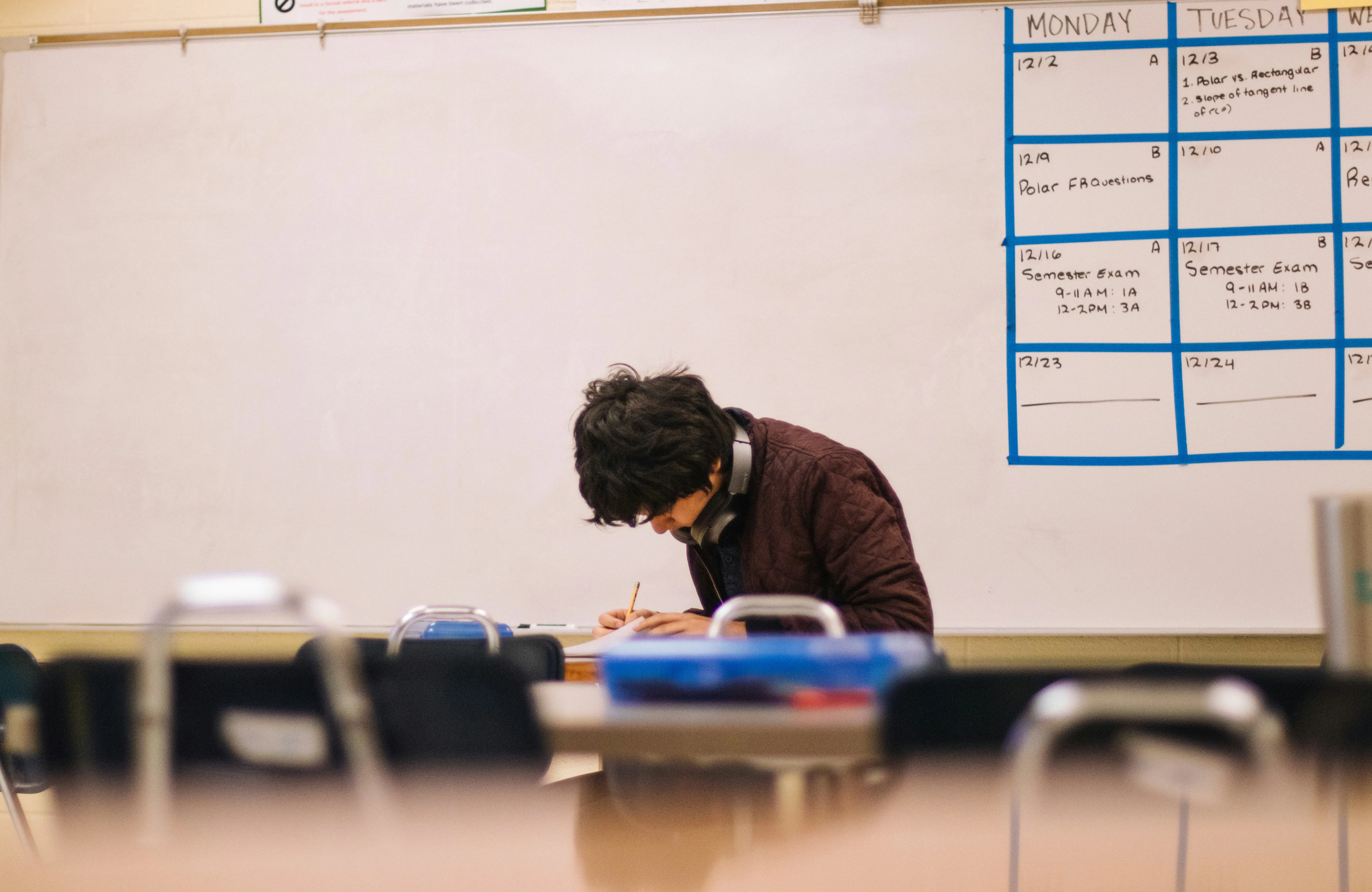 Young lecturer working at a desk