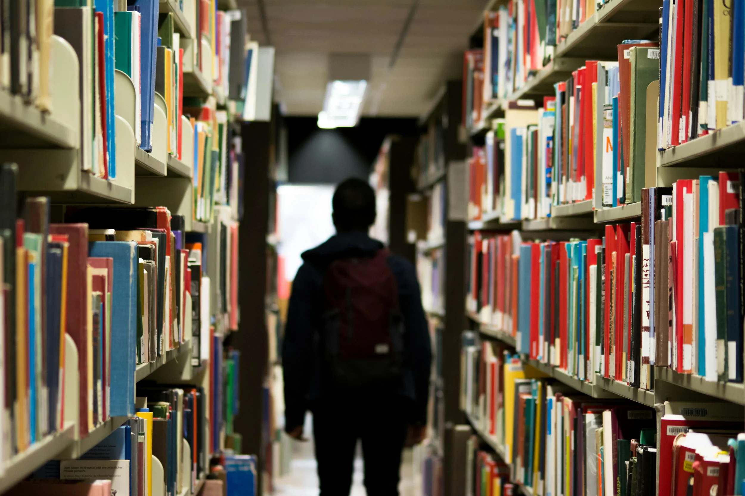 Students walking through a library