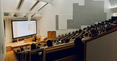Lecture theatre with students in it Lecture theatre with students in it
