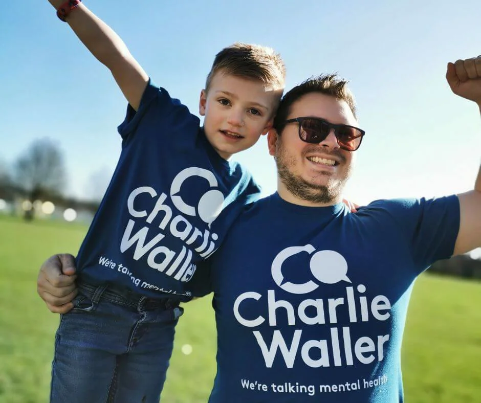 A young boy with a man wearing charlie waller tshirts A young boy with a man wearing charlie waller tshirts