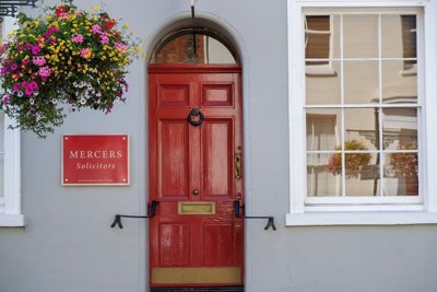 Mercers Solicitors sign and red door
