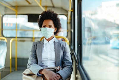 woman on bus wearing face mask