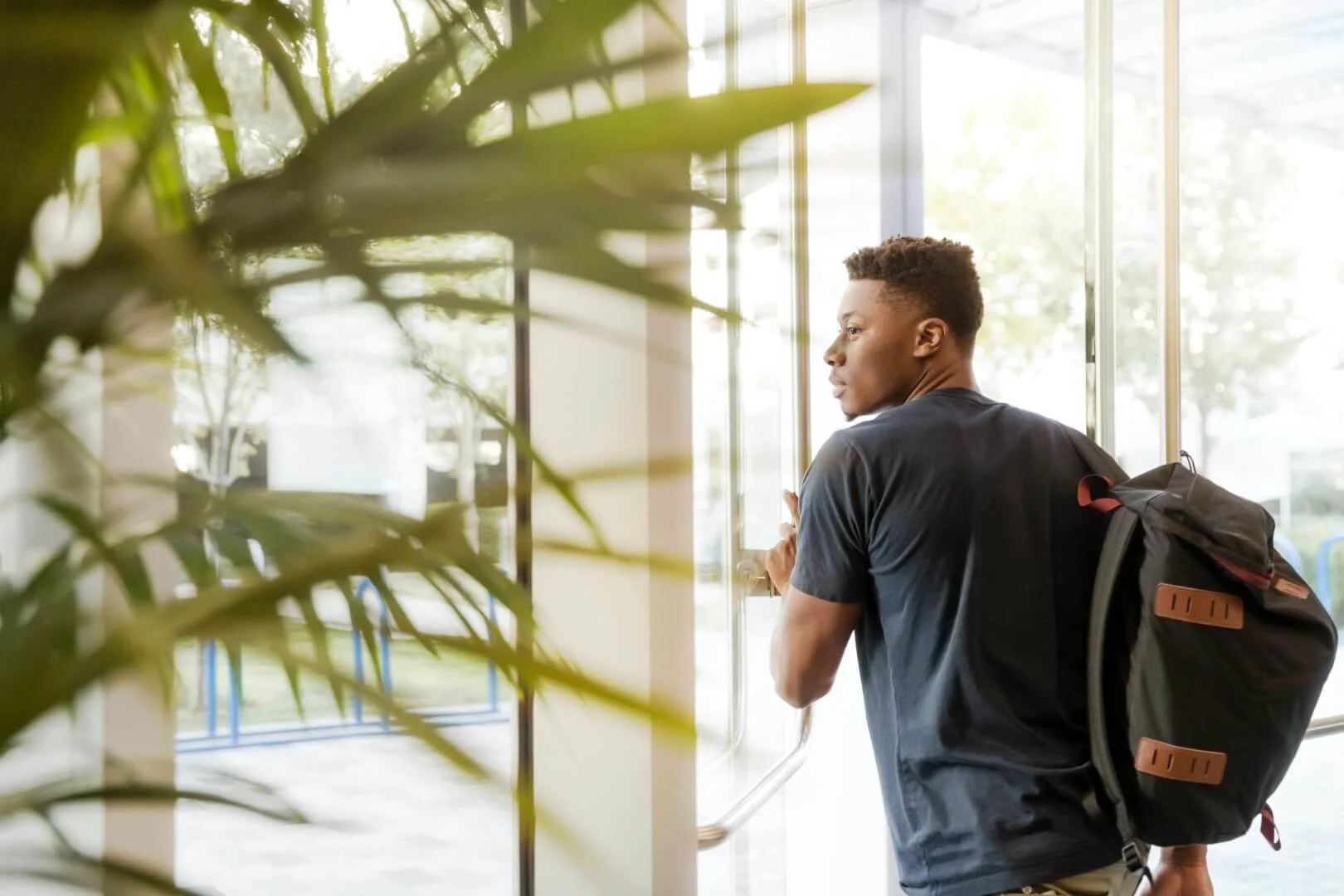 Male student with bag on