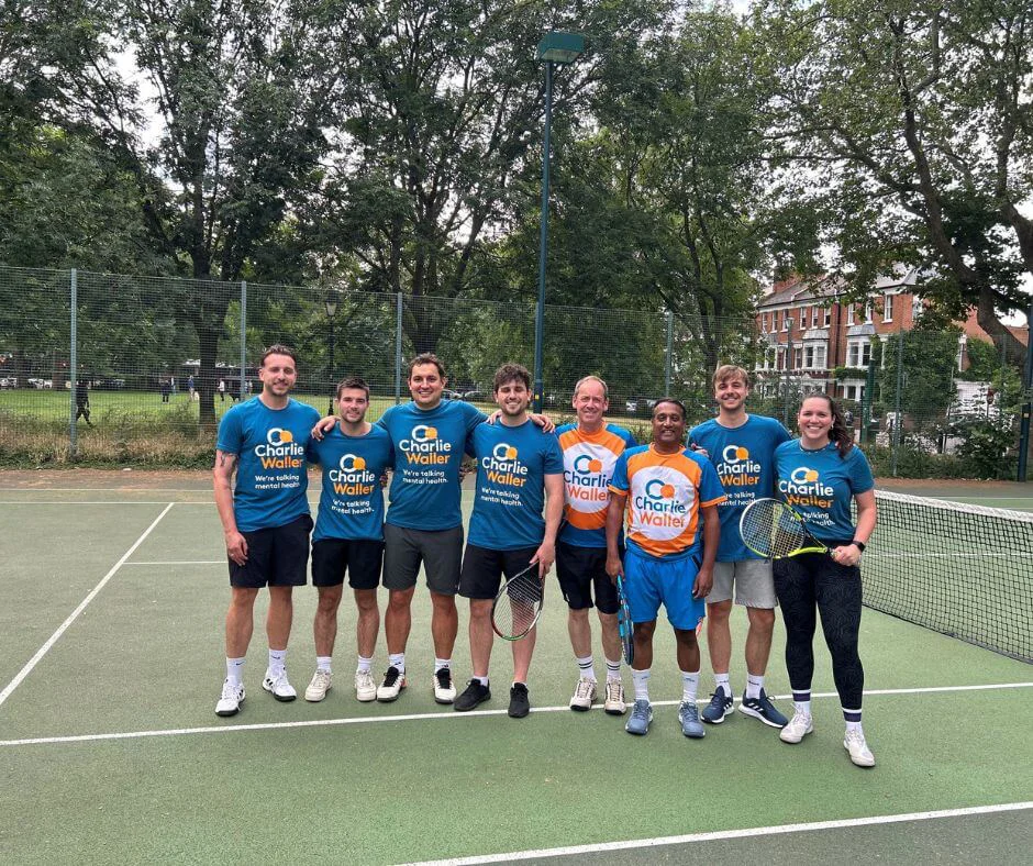 Dunhumby employees playing tennis Dunhumby employees playing tennis