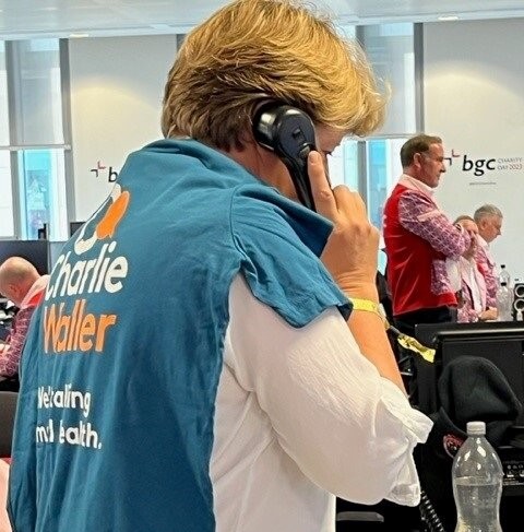 Clare Balding on phone wearing Charlie Waller T-shirt