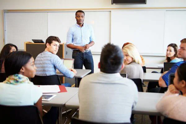 Male teacher teaching a class