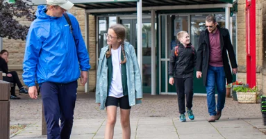 Father and daughter leaving a primary school Father and daughter leaving a primary school