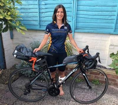 Christa Feltham from Michelmores holding bike