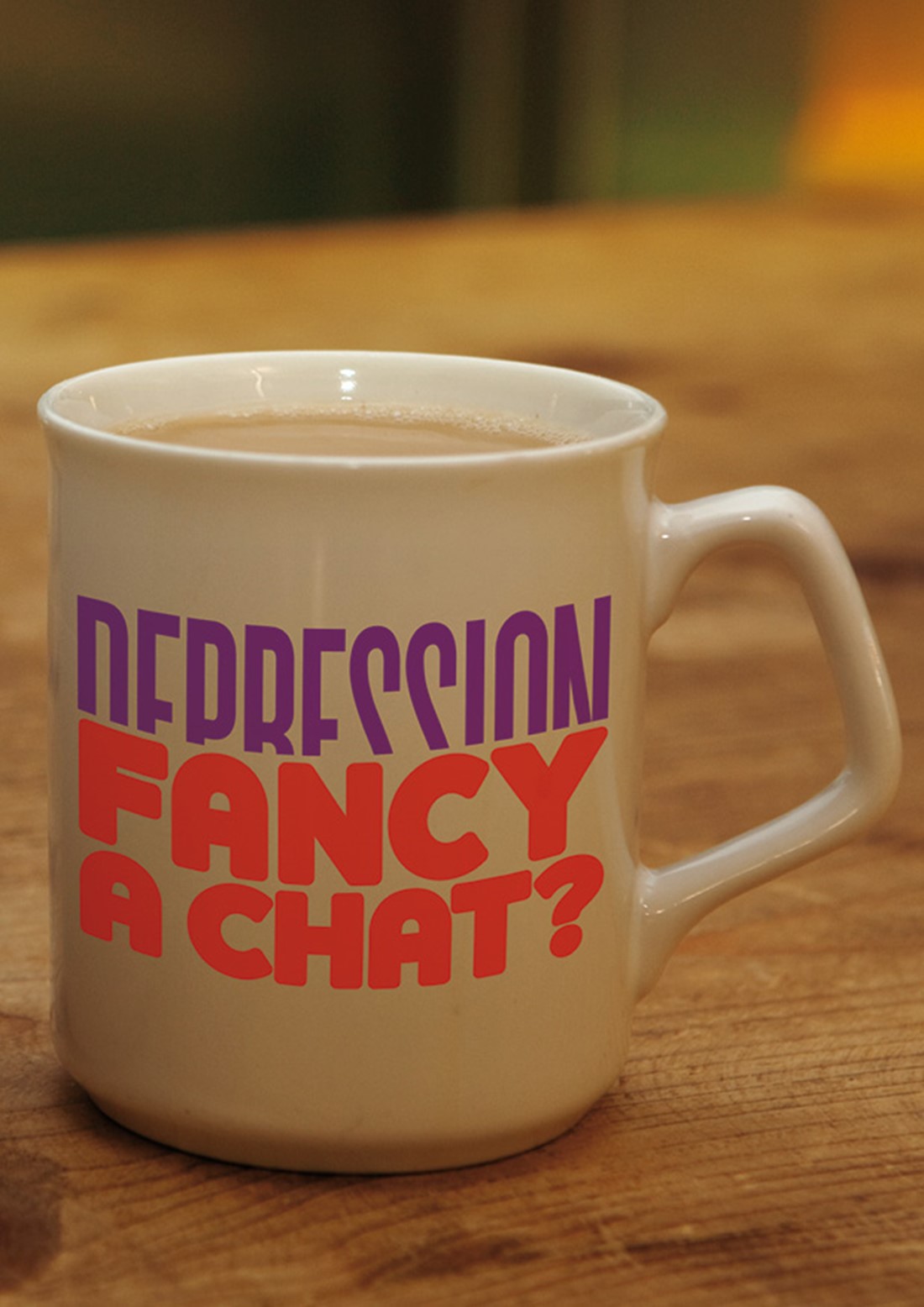 A mug of tea printed with the words 'Depression - Fancy a chat'